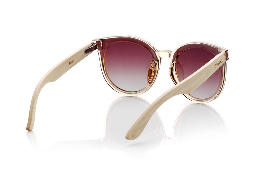 Wood eyewear of Maple GORE. GORE sunglasses are an ideal choice for women looking for a modern and sophisticated design. Its satin-finish transparent champagne frame with a very rounded shape makes these glasses adapt perfectly to the female face. The maple wood temples in conjunction with the frame add a natural and sustainable touch to the design. The lenses, mounted on the frame, offer 100% protection against UV rays and are available in two gradient colors so you can choose the one that best suits your style and needs.Front measurement approx: 142x55mm for Wholesale & Retail | Root Sunglasses® 